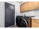 Laundry room featuring washer, dryer, and upper cabinets at 2716 N Kristen --, Mesa, AZ 85213