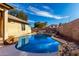 Inviting backyard pool with rock waterfall feature, ideal for relaxation and leisure at 2716 N Kristen --, Mesa, AZ 85213