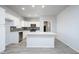 Beautiful open kitchen with stainless steel appliances and bright white cabinets at 27227 N 147Th Ave, Surprise, AZ 85387