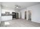 This kitchen features white cabinets, stainless steel appliances, and a view into the bathroom at 27227 N 147Th Ave, Surprise, AZ 85387