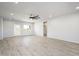 Living room featuring gray floors, a ceiling fan, and natural light at 27227 N 147Th Ave, Surprise, AZ 85387