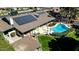 Aerial view of a home featuring a well-maintained pool area, a patio, and solar panels at 2919 W Kerry Ln, Phoenix, AZ 85027