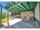 Picturesque backyard featuring a covered patio, a relaxing hammock, and a cozy fire pit at 2919 W Kerry Ln, Phoenix, AZ 85027