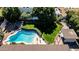 Aerial view of the backyard featuring a sparkling blue pool and lush landscaping at 2919 W Kerry Ln, Phoenix, AZ 85027