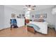 Bedroom with light blue walls, wood-look floors, and ensuite bathroom featuring double sinks, a large mirror, and vanity at 2919 W Kerry Ln, Phoenix, AZ 85027