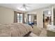 A comfortable bedroom features tan carpet, a closet with mirrored doors, and french doors leading to the outside at 2919 W Kerry Ln, Phoenix, AZ 85027