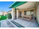 Charming front porch with brick columns and a comfortable porch swing at 2919 W Kerry Ln, Phoenix, AZ 85027