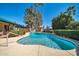 Beautiful backyard pool with a concrete deck and lush landscaping at 2919 W Kerry Ln, Phoenix, AZ 85027