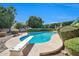 Inviting backyard pool features diving board and mature landscaping, perfect for relaxation at 2919 W Kerry Ln, Phoenix, AZ 85027