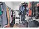 A walk-in closet with hanging clothes, shoes, handbags, luggage, and hats is the perfect place to store belongings at 2919 W Kerry Ln, Phoenix, AZ 85027