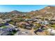 Aerial view of a desert community featuring single-Gathering homes and mountain views at 2924 W Here To There Dr, Phoenix, AZ 85086