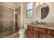 Bathroom featuring tiled shower, vanity with granite countertop, and modern fixtures at 2924 W Here To There Dr, Phoenix, AZ 85086