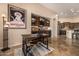 Dining area with a wet bar, wine storage, and easy access to the gourmet kitchen at 2924 W Here To There Dr, Phoenix, AZ 85086