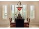 Formal dining room with seating for six under a chandelier, with a view of the backyard at 2924 W Here To There Dr, Phoenix, AZ 85086