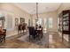 Elegant dining room with neutral walls, plantation shutters and travertine flooring at 2924 W Here To There Dr, Phoenix, AZ 85086