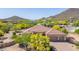 Stunning single-story home with a three-car garage surrounded by lush landscaping and mature trees at 2924 W Here To There Dr, Phoenix, AZ 85086