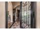 Elegant entrance with a wrought-iron door, leading to a view of the home's interior at 2924 W Here To There Dr, Phoenix, AZ 85086