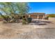 Attractive single-story home with a three-car garage and well-maintained desert landscaping at 2924 W Here To There Dr, Phoenix, AZ 85086