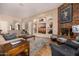 Inviting living room features a stone fireplace, recessed lighting and built in shelving at 2924 W Here To There Dr, Phoenix, AZ 85086