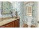 Charming powder room with designer wallpaper, granite countertop, and stylish accents at 2924 W Here To There Dr, Phoenix, AZ 85086