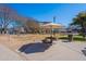 A community park with picnic table and shade umbrella offers space for recreation at 300 N Gila Springs Blvd # 164, Chandler, AZ 85226