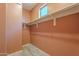 A walk-in closet features built-in shelving, offering ample storage and organization for clothing and accessories at 300 N Gila Springs Blvd # 164, Chandler, AZ 85226