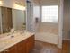 Bathroom boasts double sink vanity, and a large soaking tub, perfect for relaxing at 3007 W Jordon Ln, Phoenix, AZ 85086