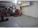 Spacious garage with epoxy floor, storage cabinets, shelving, and a motorcycle at 3007 W Jordon Ln, Phoenix, AZ 85086