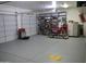 Well-organized garage featuring epoxy floor, storage cabinets, shelving, and vehicle at 3007 W Jordon Ln, Phoenix, AZ 85086