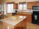 Lovely kitchen featuring an island, light wood cabinets, tile flooring, and lots of natural light at 3007 W Jordon Ln, Phoenix, AZ 85086