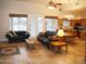 Open-concept living room showcasing tile flooring, a ceiling fan, and a seamless flow into the kitchen at 3007 W Jordon Ln, Phoenix, AZ 85086