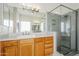 Modern bathroom with glass-enclosed shower and a large mirror above the vanity at 330 W Locust Dr, Chandler, AZ 85248