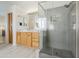 Bathroom with a glass enclosed shower and wooden vanity with a white countertop at 330 W Locust Dr, Chandler, AZ 85248