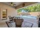 Inviting covered patio area overlooking a sparkling swimming pool and well-maintained backyard at 330 W Locust Dr, Chandler, AZ 85248