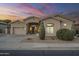 Charming single-story home with neutral stucco, manicured landscaping, and attached two-car garage at 330 W Locust Dr, Chandler, AZ 85248