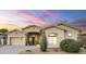 Charming single-story home with a neutral color palette, desert landscaping and inviting front entrance and attached garage at 330 W Locust Dr, Chandler, AZ 85248