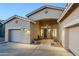 Charming home exterior with neutral colors, desert landscaping, and a welcoming front entrance at 330 W Locust Dr, Chandler, AZ 85248