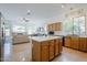 Open kitchen with bar seating that flows seamlessly into the light-filled living area at 330 W Locust Dr, Chandler, AZ 85248