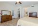 Bright main bedroom with a ceiling fan, wood floors and access to the backyard at 330 W Locust Dr, Chandler, AZ 85248