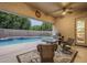 Inviting covered patio with ceiling fan, barbecue, and view of the refreshing pool and backyard at 330 W Locust Dr, Chandler, AZ 85248