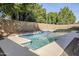 Sparkling swimming pool with blue tile accents and a tranquil backyard setting at 330 W Locust Dr, Chandler, AZ 85248