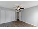 Neutral bedroom features wood-look floors, ceiling fan, and closet with sliding doors at 3500 N Hayden Rd # 2109, Scottsdale, AZ 85251