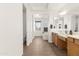 This bathroom features a bathtub, and sinks, with plenty of natural light at 3551 E Shannon St, Gilbert, AZ 85295