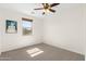 Bright bedroom with a ceiling fan, and a window offering natural light at 3551 E Shannon St, Gilbert, AZ 85295