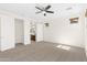 This bedroom features neutral walls, carpet, and access to an ensuite bathroom at 3551 E Shannon St, Gilbert, AZ 85295