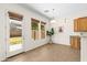 Sunny breakfast nook featuring tile flooring, large windows, and a door to the backyard at 3551 E Shannon St, Gilbert, AZ 85295