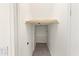 Walk-in closet, perfect for your wardrobe needs with a built-in wooden rod at 3551 E Shannon St, Gilbert, AZ 85295