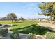 Well-maintained community park featuring lush green lawns, a playground and shaded ramada area at 3551 E Shannon St, Gilbert, AZ 85295