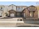 Charming two-story home featuring stone accents, well-manicured landscaping, and a welcoming front porch at 3551 E Shannon St, Gilbert, AZ 85295