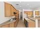 Well-lit kitchen with tile flooring, granite countertops, and stainless steel appliances at 3551 E Shannon St, Gilbert, AZ 85295